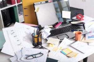 Messy and cluttered office desk